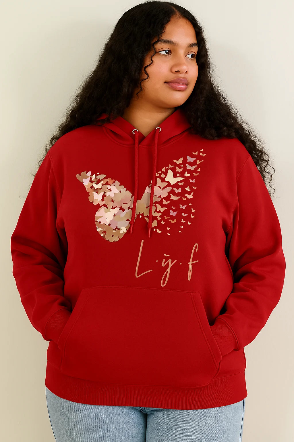 Person wearing a red hoodie with butterfly design and 'L.y.f' text on a plain background